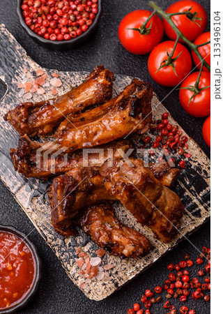 Grilled beef or pork ribs, meat cooked on a barbecue with salt and pepper. Grilled ribs 133496104