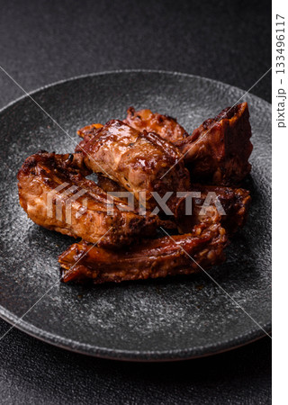 Grilled beef or pork ribs, meat cooked on a barbecue with salt and pepper. Grilled ribs 133496117