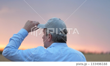 agriculture, wheat field, golden wheat farm field sunset, close up face male farmer wearing cap sunset, farmer walking through wheat field adjusting cap, mosquitoes flying near farmer face, man nature 133496188