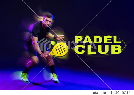 Exciting padel player in action at a vibrant indoor court with club branding Exciting padel player in action at a vibrant indoor court with club branding 133496734