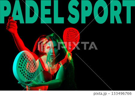 Dynamic player showcasing skills in padel sport during an evening match indoors Dynamic player showcasing skills in padel sport during an evening match indoors 133496766
