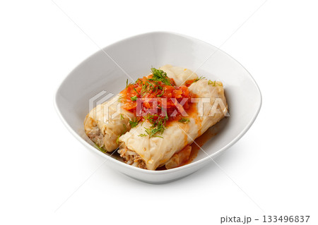 Savory stuffed cabbage rolls with tomato sauce served in a white bowl Savory stuffed cabbage rolls with tomato sauce served in a white bowl 133496837