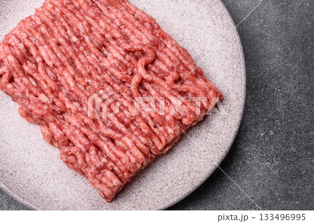 Raw ground beef or pork, fresh meat for burgers or other dishes. Raw beef minced meat Raw ground beef or pork, fresh meat for burgers or other dishes. Raw beef minced meat 133496995