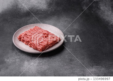 Raw ground beef or pork, fresh meat for burgers or other dishes. Raw beef minced meat Raw ground beef or pork, fresh meat for burgers or other dishes. Raw beef minced meat 133496997