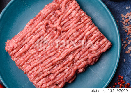 Raw ground beef or pork, fresh meat for burgers or other dishes. Raw beef minced meat Raw ground beef or pork, fresh meat for burgers or other dishes. Raw beef minced meat 133497009