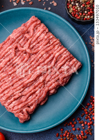 Raw ground beef or pork, fresh meat for burgers or other dishes. Raw beef minced meat Raw ground beef or pork, fresh meat for burgers or other dishes. Raw beef minced meat 133497010