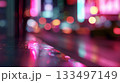 Colorful reflections and blurred lights create a vibrant street scene at night 133497149