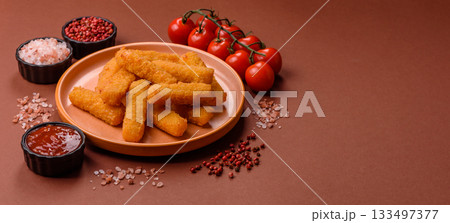 Mozzarella cheese sticks, crispy nutritious fast food. Cheese sticks as food background Mozzarella cheese sticks, crispy nutritious fast food. Cheese sticks as food background 133497377