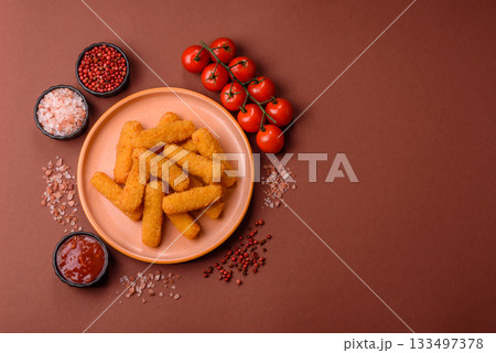 Mozzarella cheese sticks, crispy nutritious fast food. Cheese sticks as food background Mozzarella cheese sticks, crispy nutritious fast food. Cheese sticks as food background 133497378