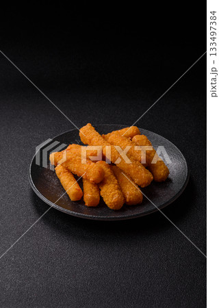 Mozzarella cheese sticks, crispy nutritious fast food. Cheese sticks as food background 133497384