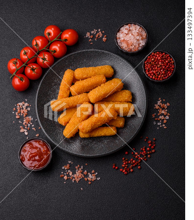 Mozzarella cheese sticks, crispy nutritious fast food. Cheese sticks as food background Mozzarella cheese sticks, crispy nutritious fast food. Cheese sticks as food background 133497394