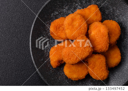 Chicken nugget with sauce, crispy nutritious fast food. Chicken nugget Chicken nugget with sauce, crispy nutritious fast food. Chicken nugget 133497452