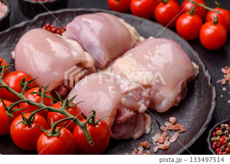 Chicken or turkey raw thigh fillet, skinless and boneless poultry meat. Chicken thigh fillet 133497514