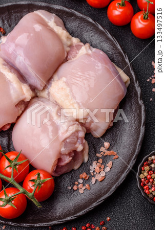 Chicken or turkey raw thigh fillet, skinless and boneless poultry meat. Chicken thigh fillet Chicken or turkey raw thigh fillet, skinless and boneless poultry meat. Chicken thigh fillet 133497516
