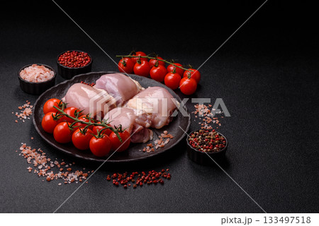 Chicken or turkey raw thigh fillet, skinless and boneless poultry meat. Chicken thigh fillet Chicken or turkey raw thigh fillet, skinless and boneless poultry meat. Chicken thigh fillet 133497518