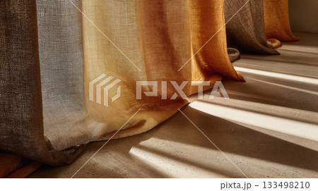 Soft sunlight streaming through colorful curtains Soft sunlight streaming through colorful curtains 133498210