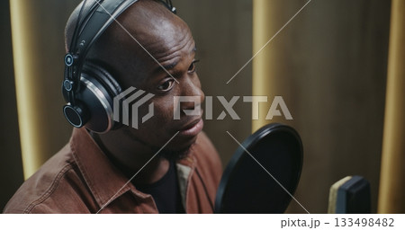Male Voice Actor Delivering Dynamic Film Dubbing Male Voice Actor Delivering Dynamic Film Dubbing 133498482