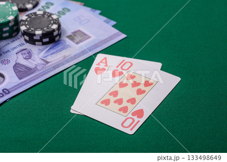 Casino game in the United Arab Emirates, dirham, chips, cards. Gambling in casinos in the Emirates 133498649