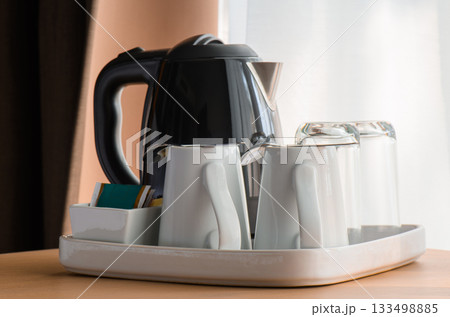 Kettle and tea cup in the living room 133498885