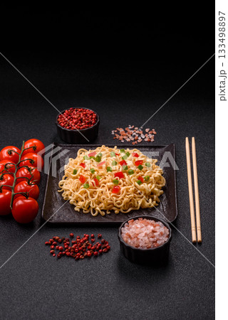 Asian food, chinese or thai rice noodles with vegetables and meat. Rice noodles Asian food, chinese or thai rice noodles with vegetables and meat. Rice noodles 133498897