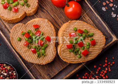 Vegan sandwiches with bread, mushroom or bean pate and vegetables. Vegetarian pate sandwiches 133498923