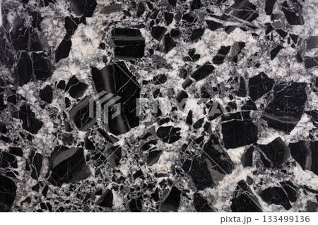 Beautiful black and white stone surface showcasing unique natural patterns and textures 133499136