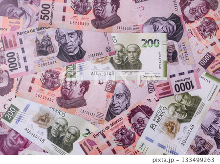 Mexican paper money, pesos in various denominations. Mexican money 133499263