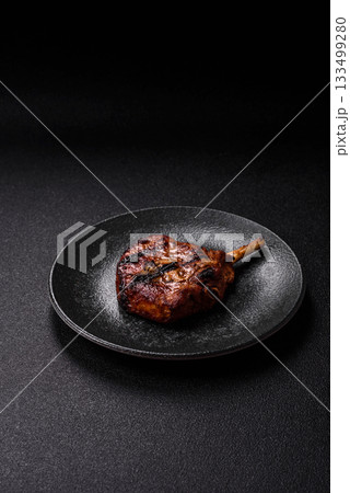 Steak, beef or pork on the bone, meat cooked on the grill with rosemary. Steak on the bone Steak, beef or pork on the bone, meat cooked on the grill with rosemary. Steak on the bone 133499280
