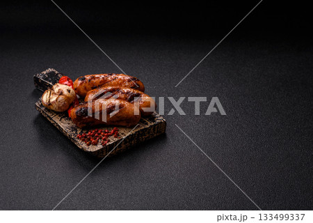 Grilled chicken or beef sausages with sauce and spices. Grilled sausages Grilled chicken or beef sausages with sauce and spices. Grilled sausages 133499337