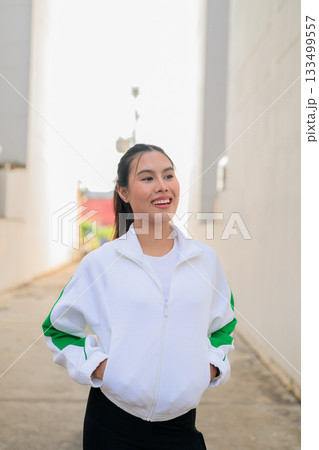 Young Asian Woman in Sporty Casual Outfit Outdoors 133499557