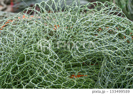 The green fishing nets on the beach The green fishing nets on the beach 133499589