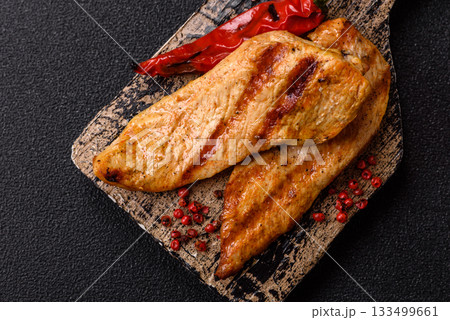 Grilled chicken or turkey breast, a healthy lunch option. Grilled chicken steak 133499661