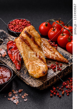 Grilled chicken or turkey breast, a healthy lunch option. Grilled chicken steak 133499667