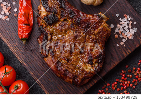 Grilled bone-in meat, beef tomahawk steak, juicy barbecued meat. Tomahawk steak 133499729