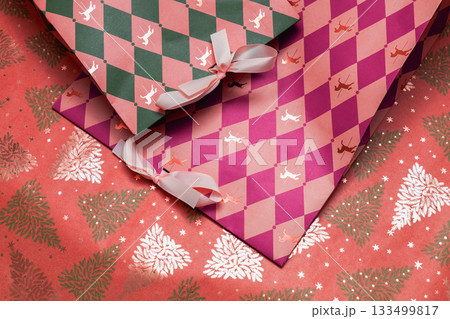Christmas gift bags on red background with trees Christmas gift bags on red background with trees 133499817