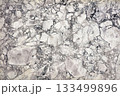 Swirling patterns of grey and white create a stunning marble background for design 133499896