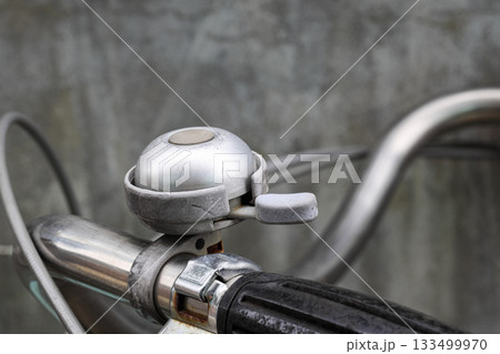 Retro metal bicycle bell, Vintage rusty bike bell on old bicycle ensures security in the road traffic for bikers and pedestrian. 133499970