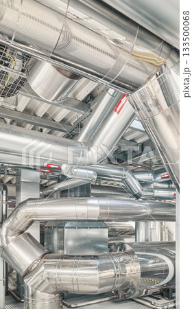 Heating and cooling pipe system with exhaust silencer in a heating plant. 133500068