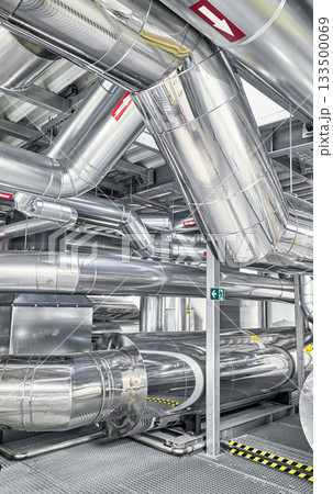 Heating and cooling pipe system with exhaust silencer in a heating plant. 133500069