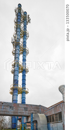 The chimney of a coal fired power plant supplying the district heating network. The chimney of a coal fired power plant supplying the district heating network. 133500070