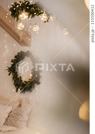 White wooden window frame with blurred warm lights in festive indoor setting White wooden window frame with blurred warm lights in festive indoor setting 133500412