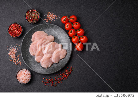 Slices of raw chicken or turkey breast, skinless and boneless. Chicken breast slices Slices of raw chicken or turkey breast, skinless and boneless. Chicken breast slices 133500972