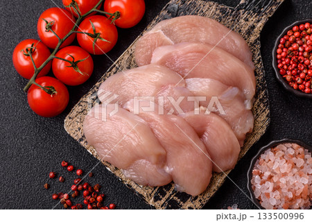Slices of raw chicken or turkey breast, skinless and boneless. Chicken breast slices Slices of raw chicken or turkey breast, skinless and boneless. Chicken breast slices 133500996
