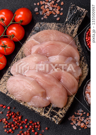 Slices of raw chicken or turkey breast, skinless and boneless. Chicken breast slices Slices of raw chicken or turkey breast, skinless and boneless. Chicken breast slices 133500997