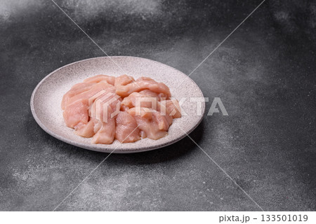 Strips of raw chicken or turkey fillet, skinless and boneless poultry breast. Chicken fillet strips 133501019