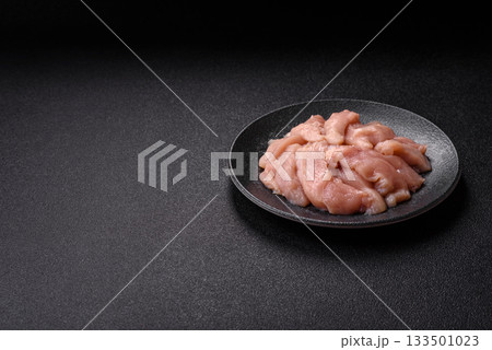 Strips of raw chicken or turkey fillet, skinless and boneless poultry breast. Chicken fillet strips Strips of raw chicken or turkey fillet, skinless and boneless poultry breast. Chicken fillet strips 133501023