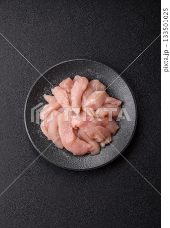 Strips of raw chicken or turkey fillet, skinless and boneless poultry breast. Chicken fillet strips Strips of raw chicken or turkey fillet, skinless and boneless poultry breast. Chicken fillet strips 133501025
