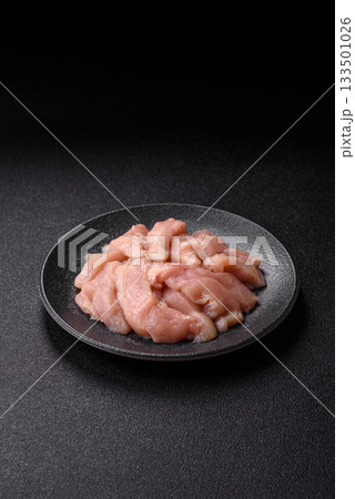Strips of raw chicken or turkey fillet, skinless and boneless poultry breast. Chicken fillet strips Strips of raw chicken or turkey fillet, skinless and boneless poultry breast. Chicken fillet strips 133501026