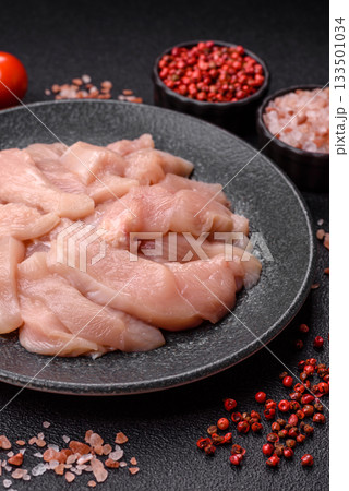 Strips of raw chicken or turkey fillet, skinless and boneless poultry breast. Chicken fillet strips 133501034
