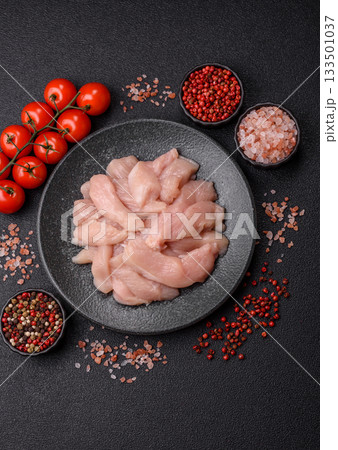 Strips of raw chicken or turkey fillet, skinless and boneless poultry breast. Chicken fillet strips Strips of raw chicken or turkey fillet, skinless and boneless poultry breast. Chicken fillet strips 133501037